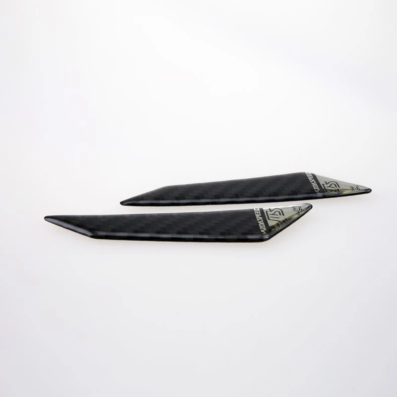 Soft carbon fiber emblem